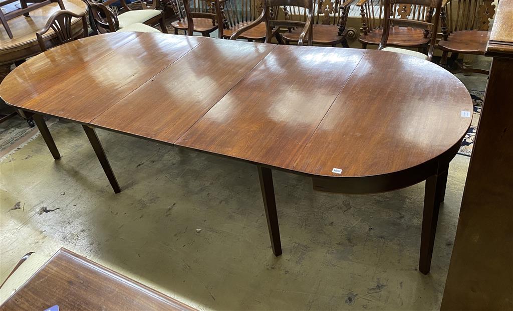 A George III mahogany D end dining table, on square tapered legs, with three spare leaves, 274cm extended, one spare leaf, width 107c